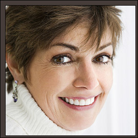 woman with brunette hair and earrings
